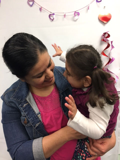A mother with her daughter at Make-it Take-it day